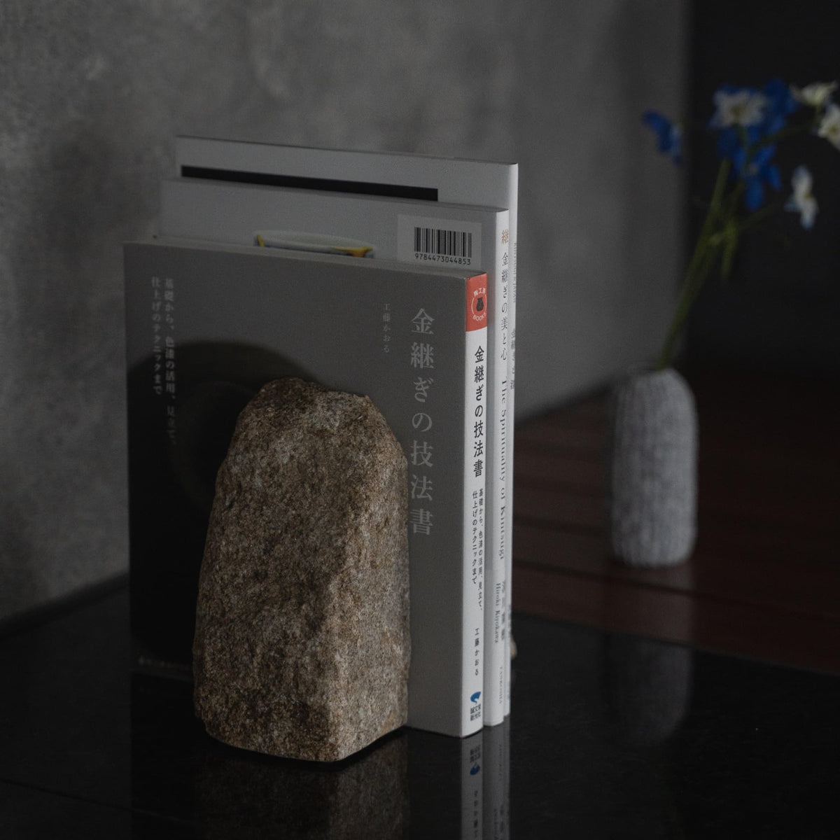A Japanese Aji Stone Book End on a table in living room