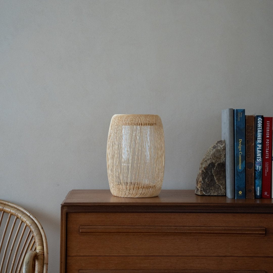Japanese Bamboo Flower Vase "Cocoon" on a wood shelf in Japandi room - Ikebana flower vase with wabi-sabi aethetics