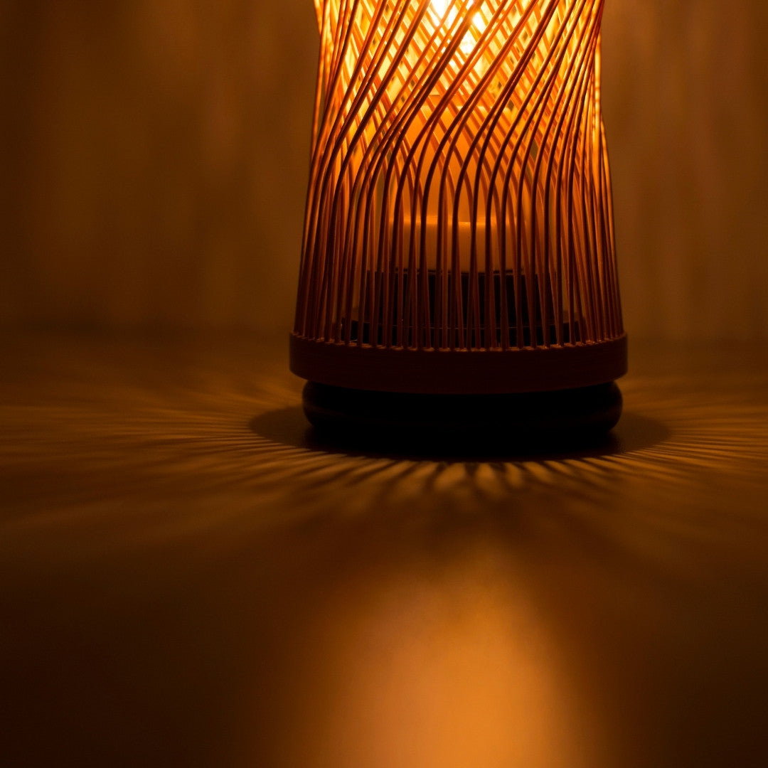 Japanese Bamboo Table Lamp “Single Bloom” emitting warm glow - unique portable table lamp perfect for bedside