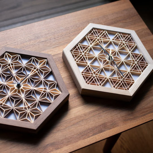 Japanese kumiko clocks on a wood table in a Japandi living room.
