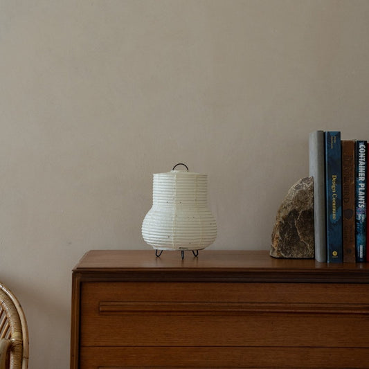 Japanese Paper Table Lamp "PAPERSON 02" on a wood table in Japandi living room - Unique bedside lamp for Japandi interior