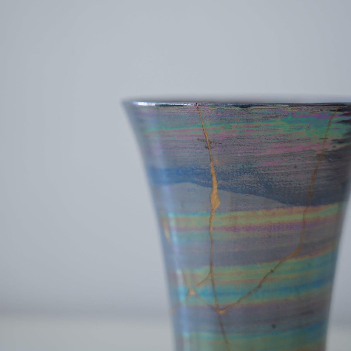 Close-up of Kintsugi Cup "Sirius" side, highlighting the intricate Kintsugi repairs