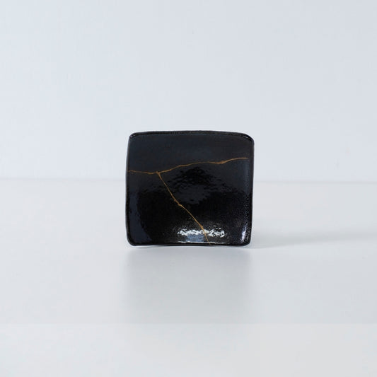Side view of Kintsugi Square Plate "Jet Black Lighting" 04 in a white background
