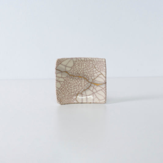 Side view of Kintsugi Square Plate "Vermilion Crackle" 02 in a white background