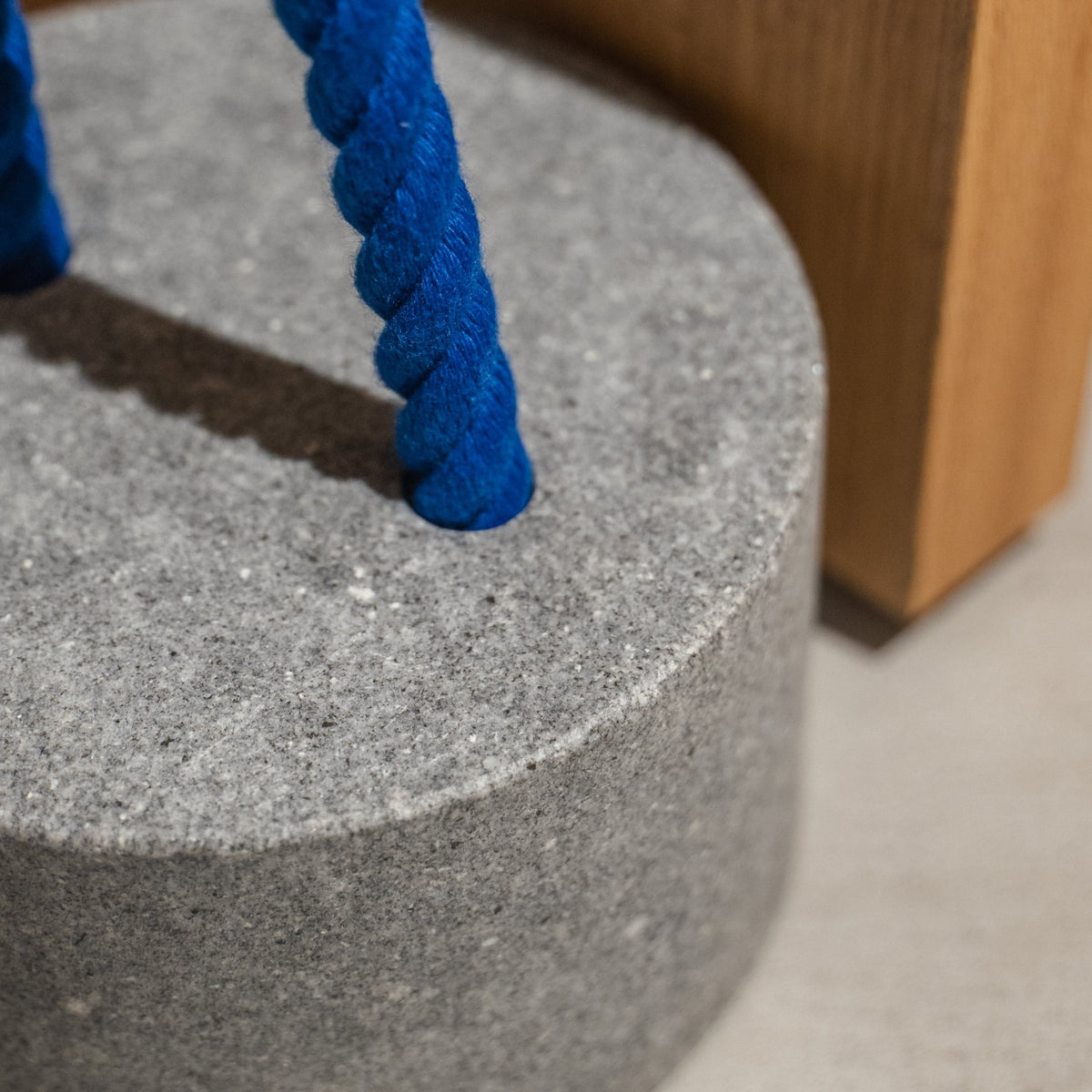 Japanese Aji Stone Doorstop "FUJ" in natural stone styled in a styled room, detail lifestyle view.