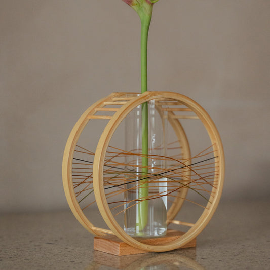 Japanese Bamboo Flower Vase "Flowing Wind" in brown styled in a styled room, detail lifestyle view.