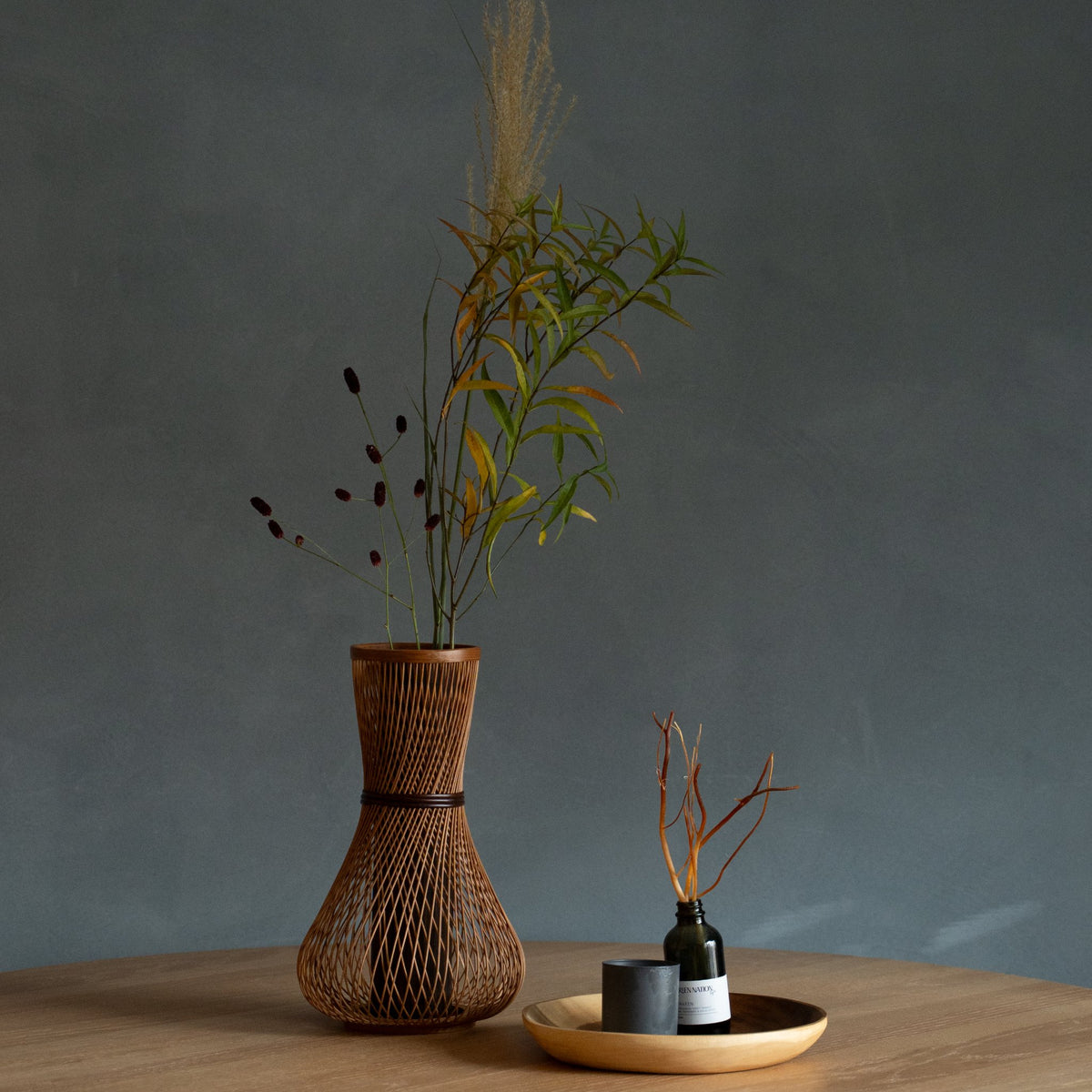 Japanese Bamboo Flower Vase "Fukuju" in brown styled in a dining room setting, dining scene view.