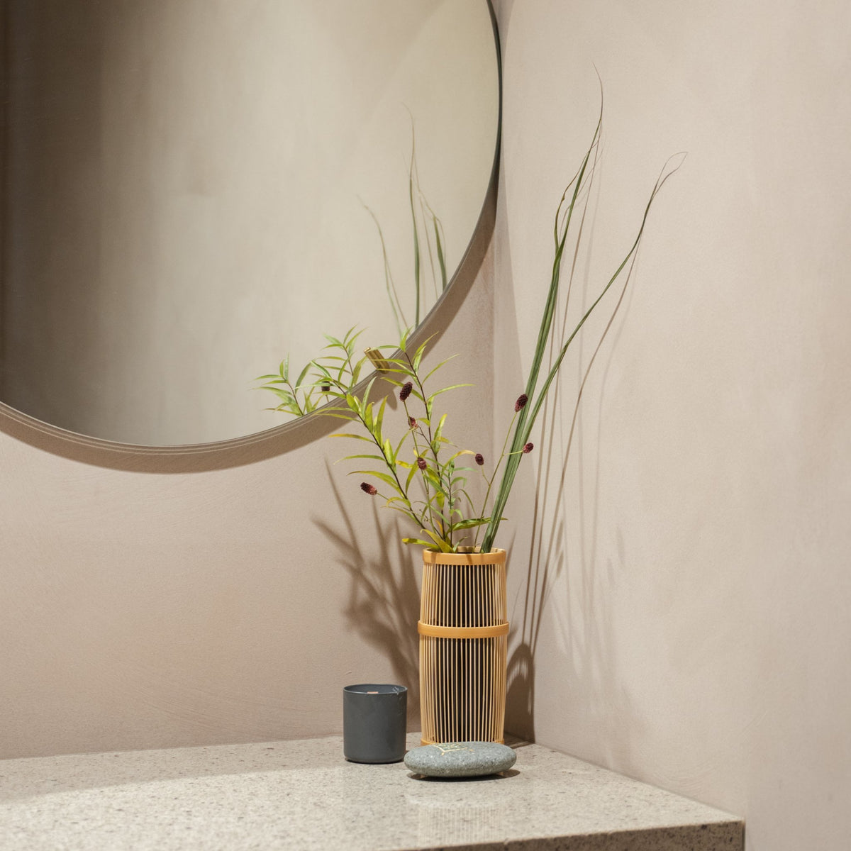 Japanese Bamboo Flower Vase "Shiori" in brown styled in a entryway setting, entryway scene view.