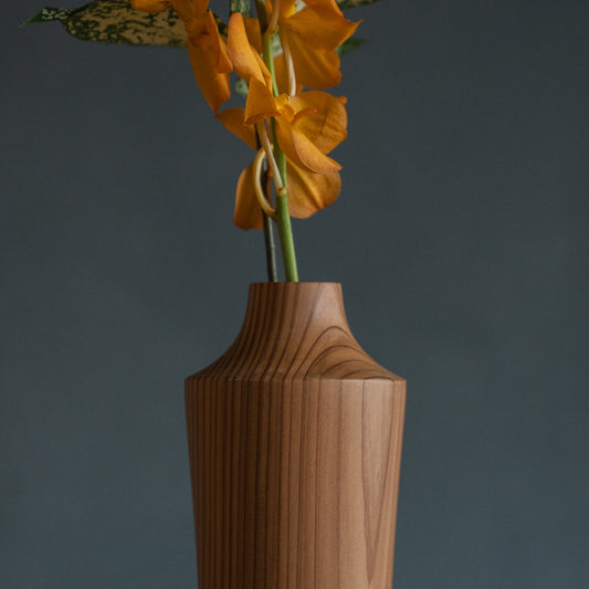 Japanese Cedar Ikebana Vase Natural Wood 02 in brown styled in a dining room setting, dining scene view.