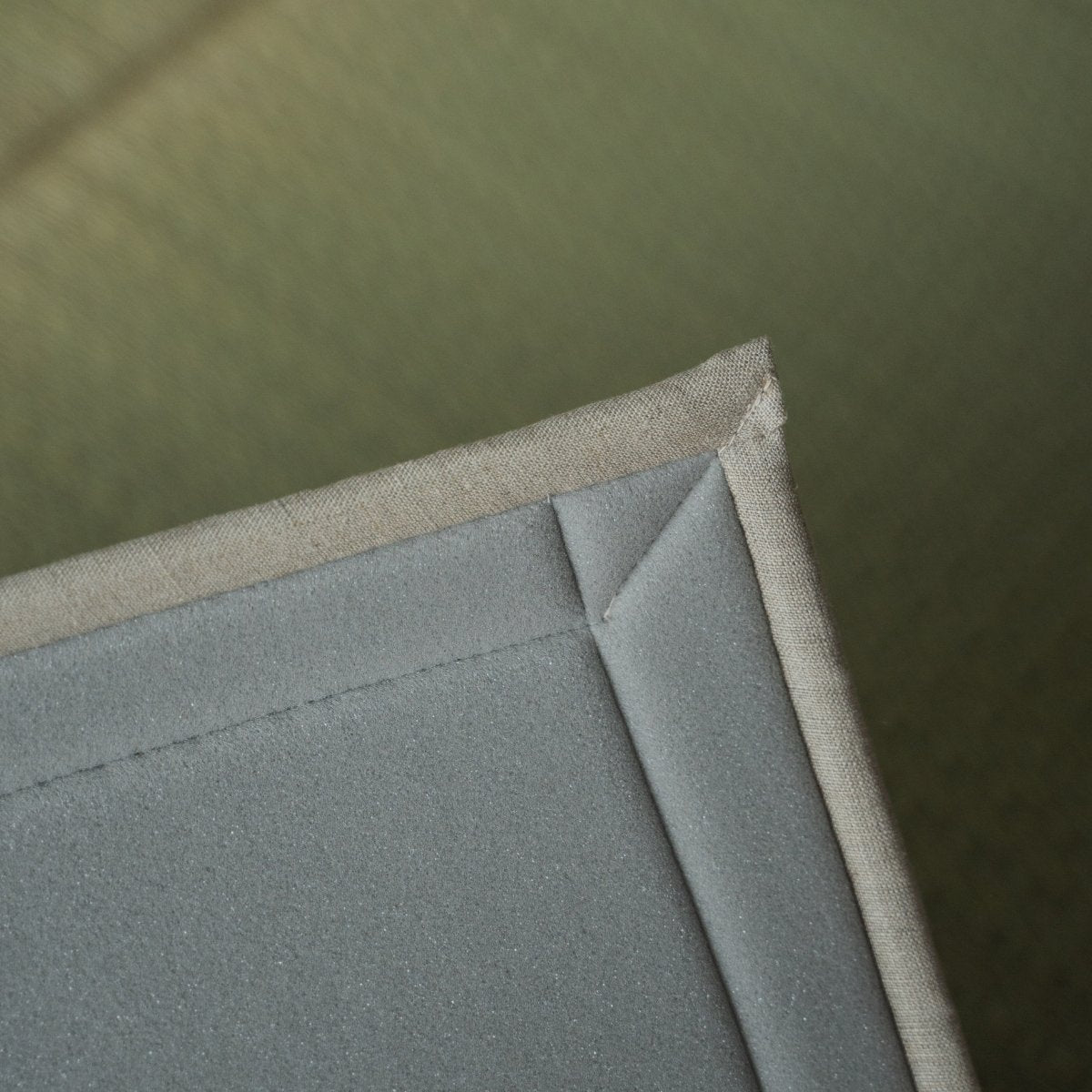 Japanese natural rush tatami area rug showing its urethane foam backing, providing a soft base for meditation and yoga.