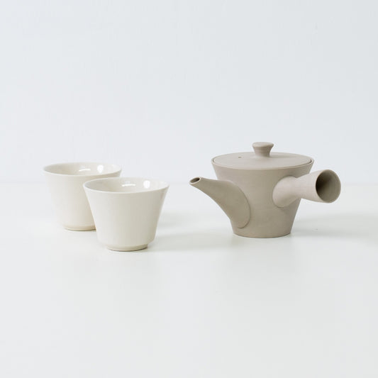 Nankei pottery japanese tea set with a white sencha kyusu and two glossy high footed kodai cups for traditional serving.