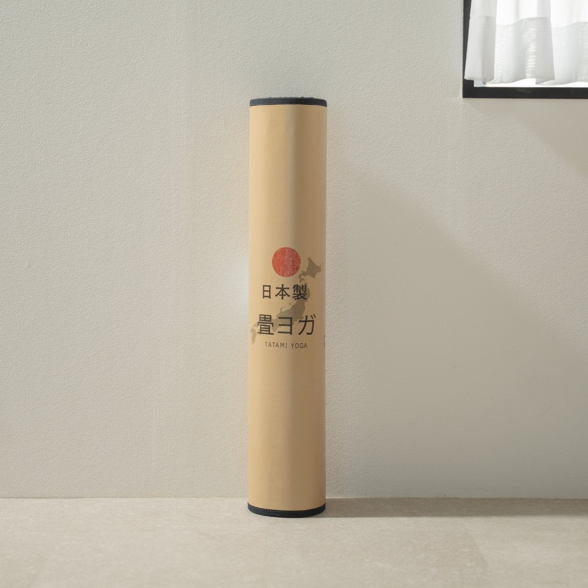 Packaged Japanese Tatami Yoga Mattress "Sarasa" Navy standing by a window, ready to support your daily mindful meditation.