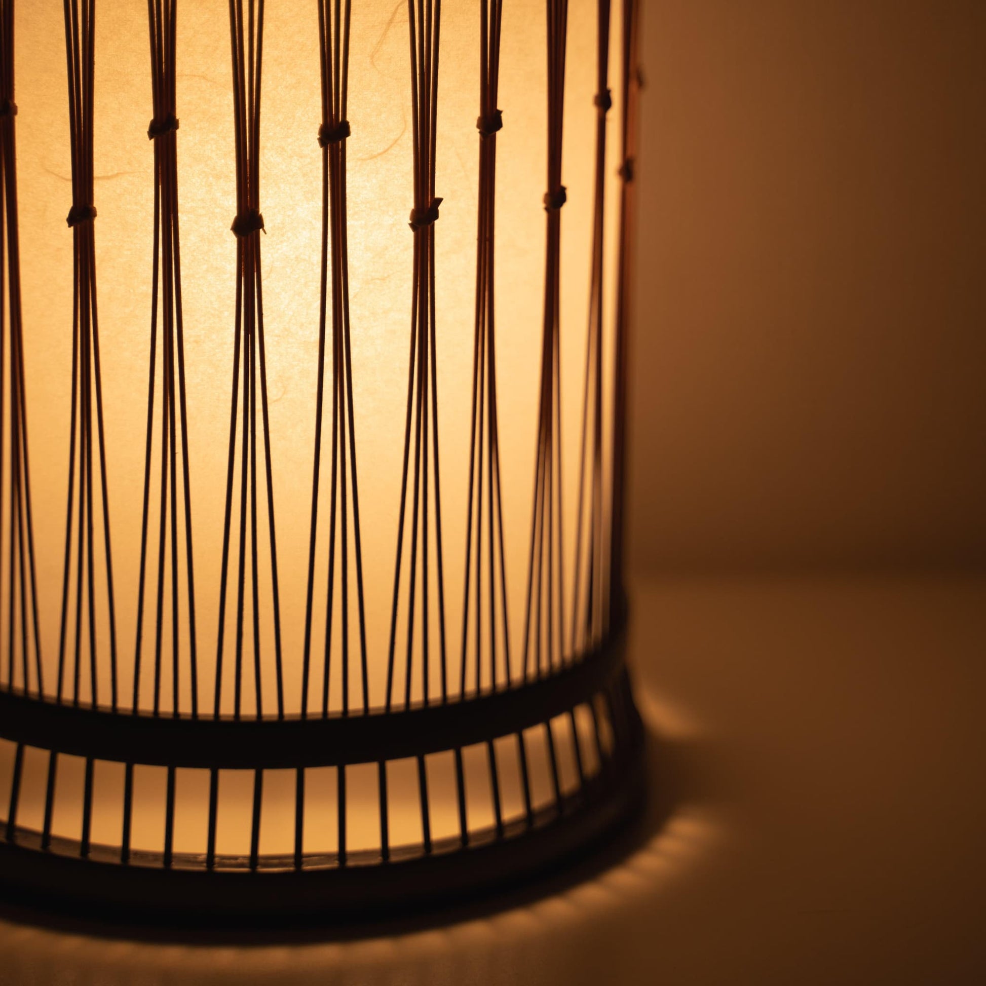 "Exquisite Japanese bamboo lamp handcrafted with 800-year-old Shizuoka bamboo artistry. Delicate design casts a soft, warm glow."
