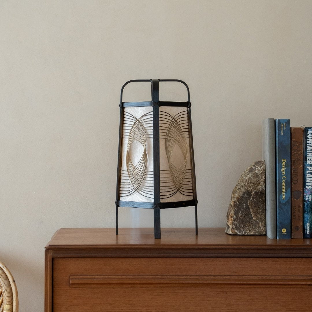 Japanese Bamboo Floor Lamp "Sunlight" on a wood shelf in Japandi room - Unique bamboo night lamp for Japandi bedroom