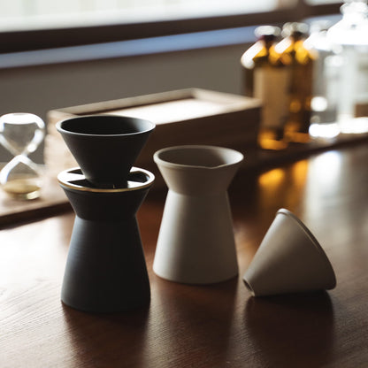 Pair of Black and White  Banko yaki Coffee Servers on Wooden Table