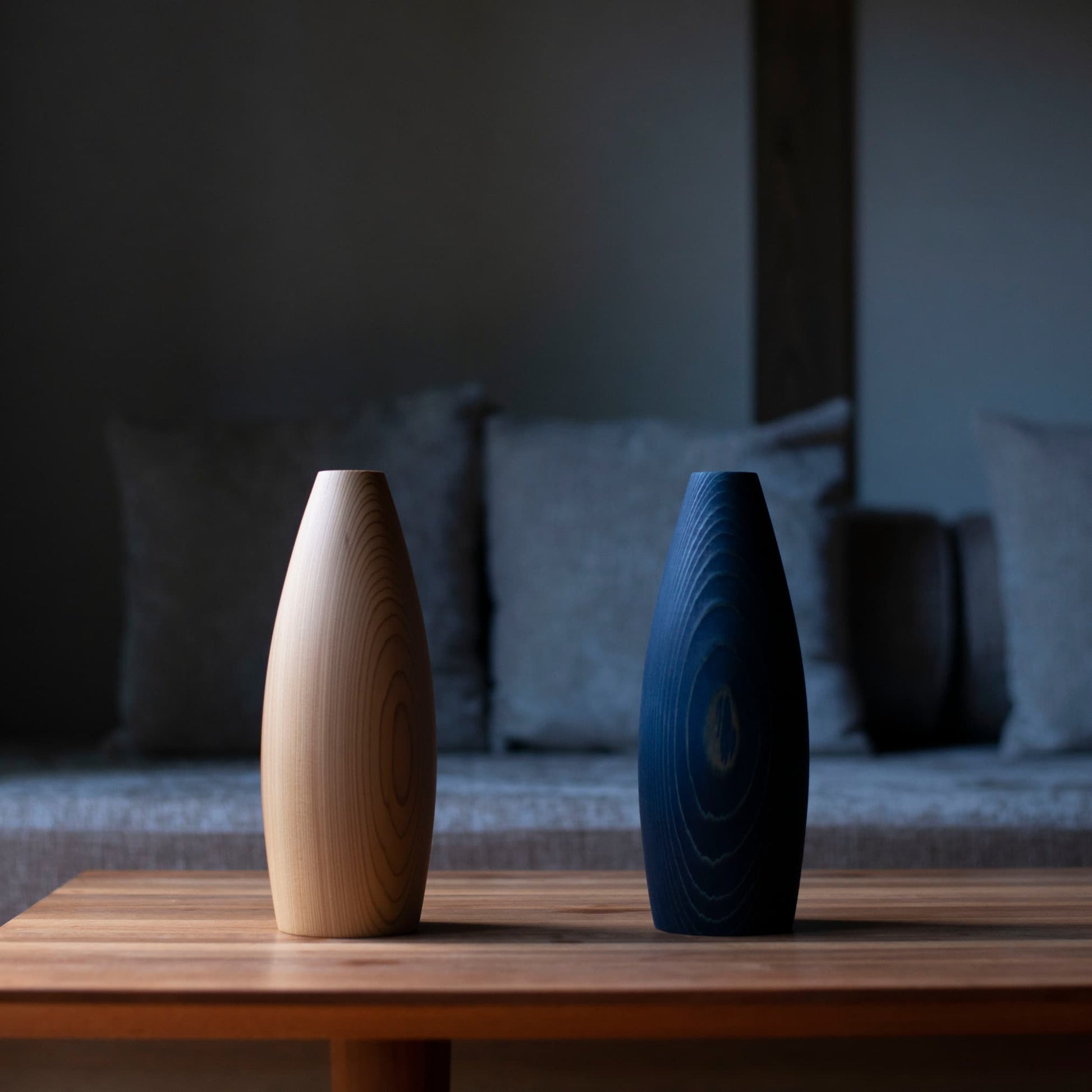 Japanese cedar wood Ikebana vases on a table in Japandi living room. 