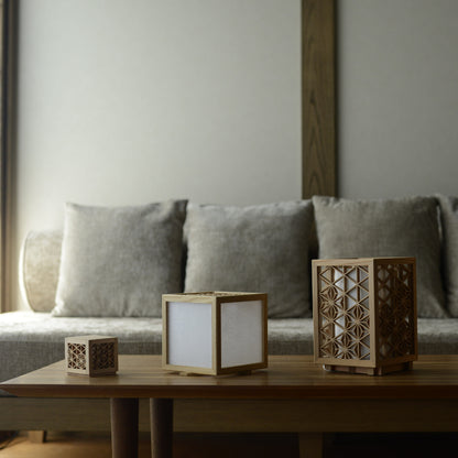 Kumiko table lamps and lanterns on a table in Japandi living room. 
