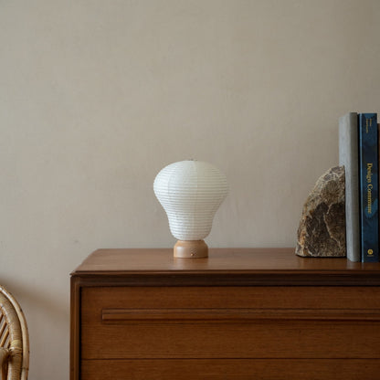 Japanese Paper Table Lamp "Balloon" on wooden shelf in Japandi style room – Unique table lamps for Japandi bedroom & living room