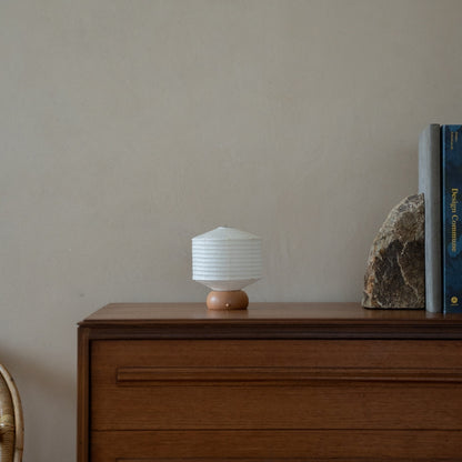 Japanese Paper Table Lamp "Mini Square" on wooden shelf in Japandi style living room – Unique Portable paper lamp for Japandi interior