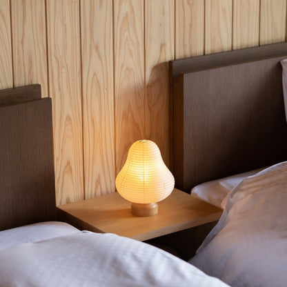 Japanese Paper Table Lamp "Mountain" on a bedside table