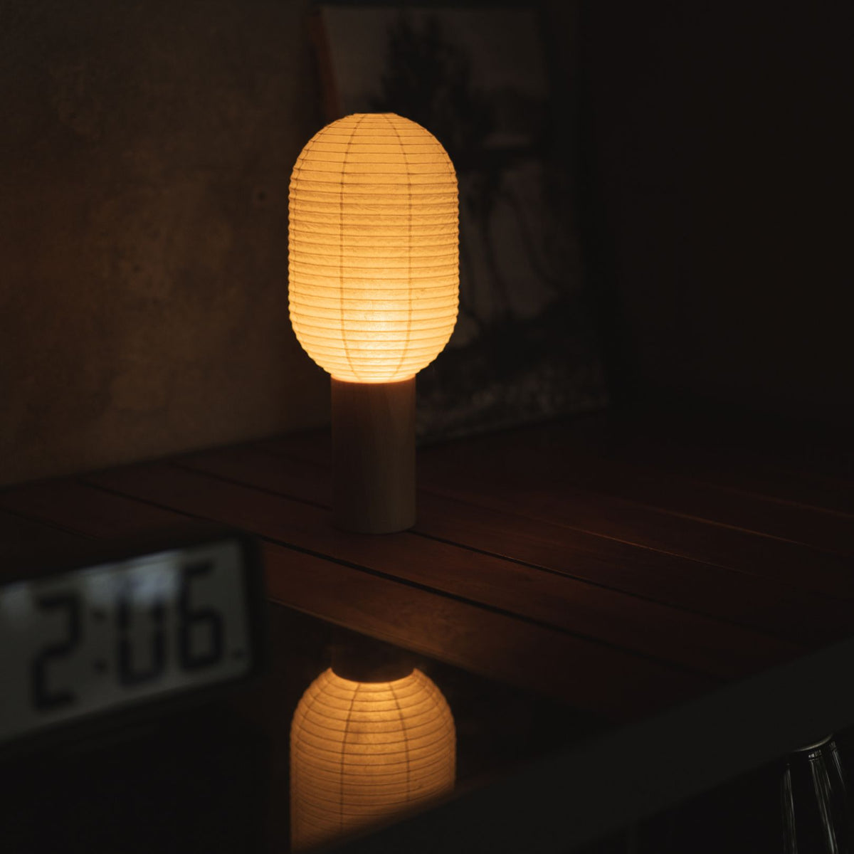Japanese Paper Table Lamp "TORCHIN VERTICAL" Placed on a Living Room Console Table