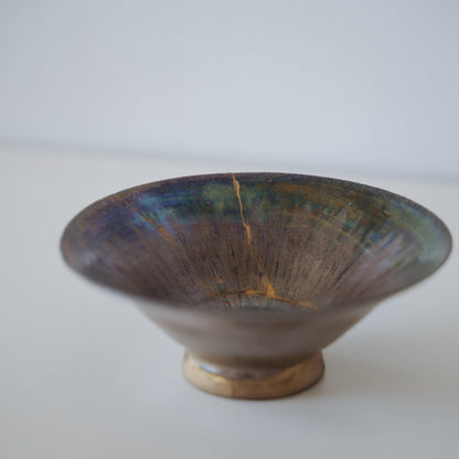 Side close up view of Kintsugi Bowl "Supernova" in a white background