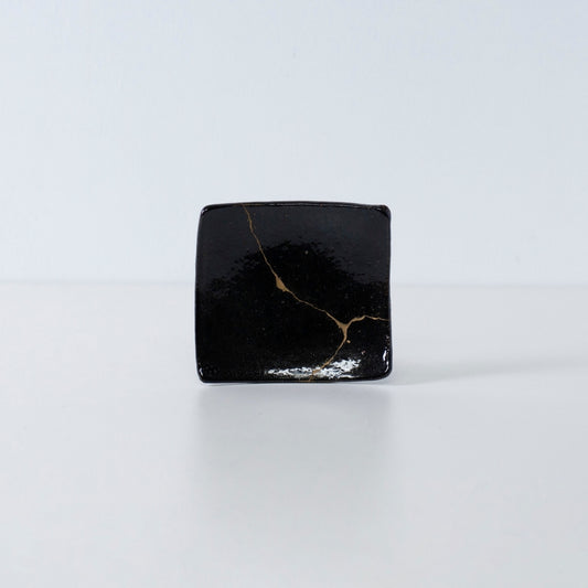 Side view of Kintsugi Square Plate "Jet Black Lighting" 05 in a white background