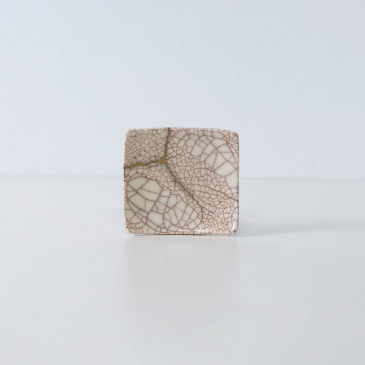 Side view of Kintsugi Square Plate "Vermilion Crackle" 06 in a white background