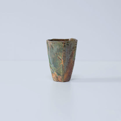 Side view of Pentagon Kintsugi Cup "Oribe" Deep Green 01 against white background