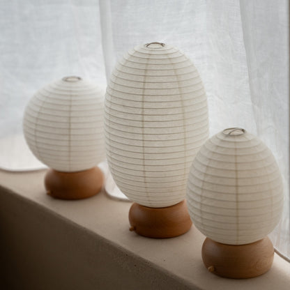 Three Rounded Japanese Paper Table Lamps on window sill – Japandi style portable lamps for bedroom & living room