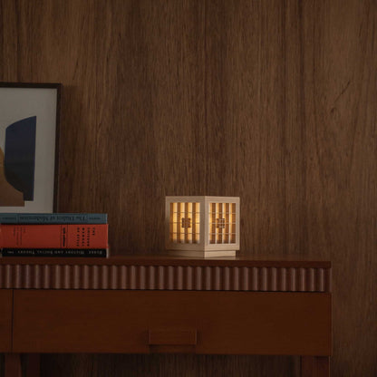 Lit Japanese Wood Table Lamp "Honoka" on a mid-century modern console table, adding a warm glow to mid-century modern living room.