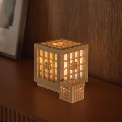 Japanese wood table lamp "Honoka" and "Hotaru" displaying Kumiko woodworking on a mid-century modern style console table.
