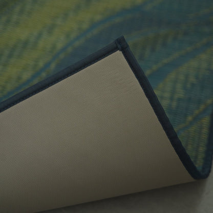 Corner of a Japanese Tatami Yoga Mattress "Marble" Blue flipped to show the non-slip TPE backing and neat fabric border.