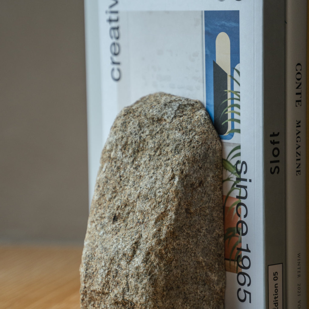 Japanese Aji Stone Book End Small in natural stone styled in a styled room, detail lifestyle view.