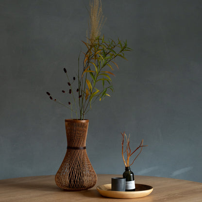 Japanese Bamboo Flower Vase "Fukuju" in brown styled in a dining room setting, dining scene view.