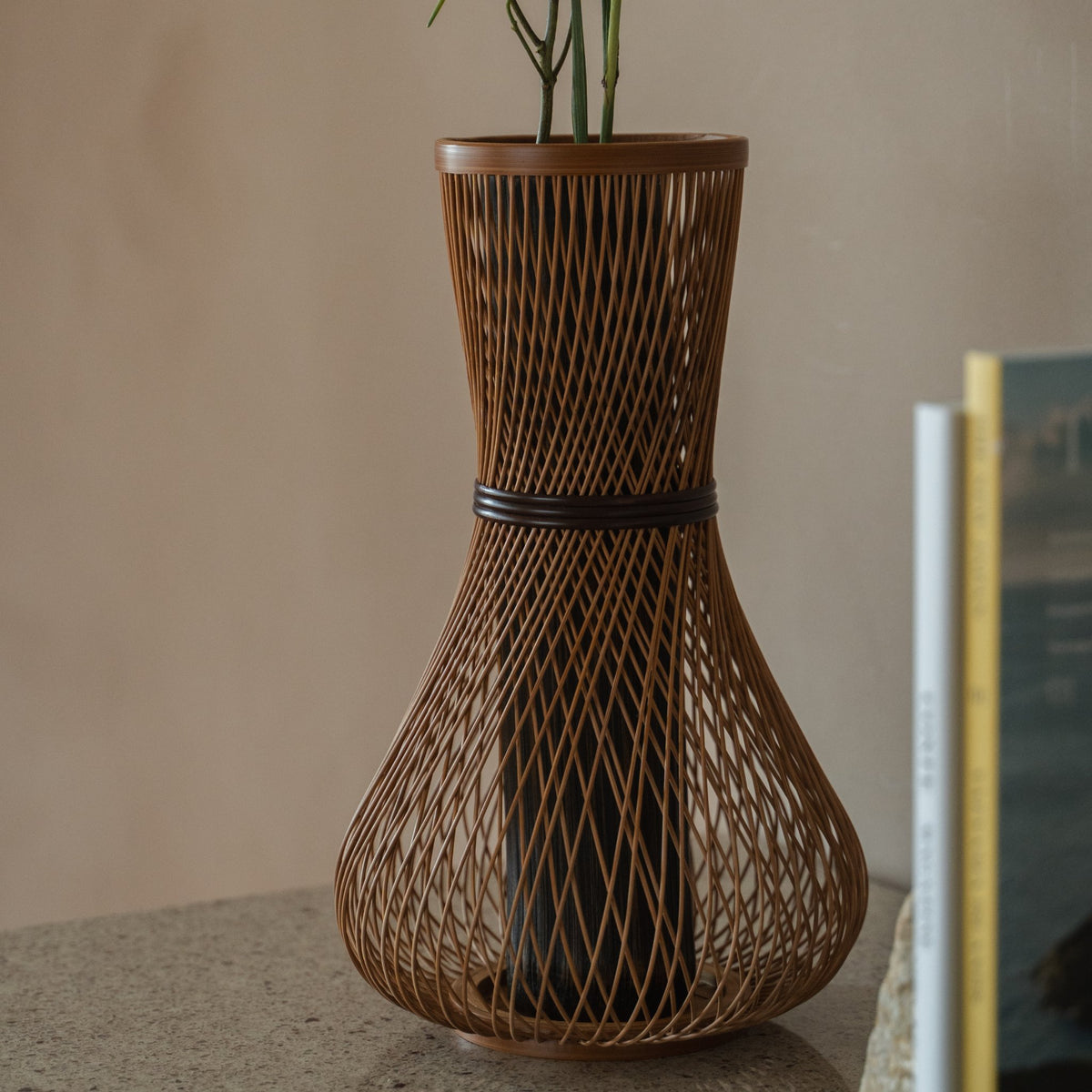 Japanese Bamboo Flower Vase "Fukuju" in brown styled in a styled room, detail lifestyle view.