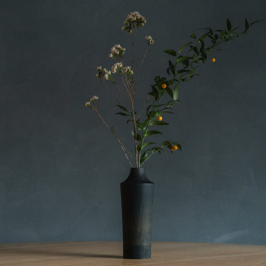 Japanese Cedar Ikebana Vase Indigo 02 in navy styled in a dining room setting, dining scene view.