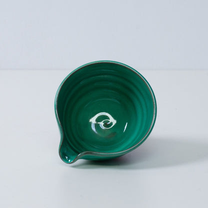 Inside view of a Japanese matcha bowl with spout "Emerald" pottery, showing the glossy emerald green glaze, made in Japan.