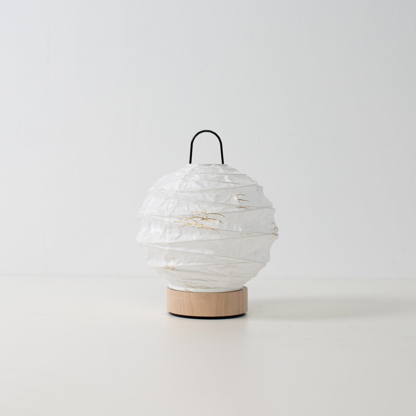 Japanese Paper Table Lamp "Yuhi" Rabbit, white, Mino Washi paper and wood - unlit round accent lamp from Japan on a white surface.