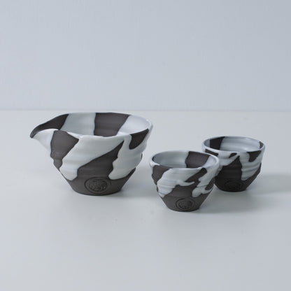 Japanese sake set "White Flow" pottery featuring a katakuchi sake carafe pitcher and two small sake cups, made in Japan.