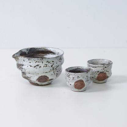 Brown and white Japanese sake set "Zui" pottery featuring a katakuchi sake carafe pitcher and two small sake cups, made in Japan.
