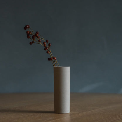 Japanese Single Flower Vase "Cylinder" in white styled in a dining room setting, dining scene view.