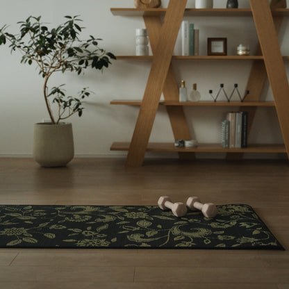 A Japanese Tatami Yoga Mattress "Sarasa" Navy with dumbbells on light wooden floor in a stylish, mindful living space.