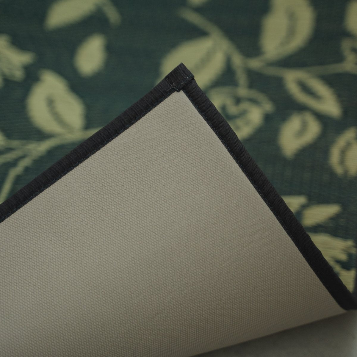 A close-up corner of a Japanese Tatami Yoga Mattress "Sarasa" Navy showing the non-slip TPE backing and neat border.