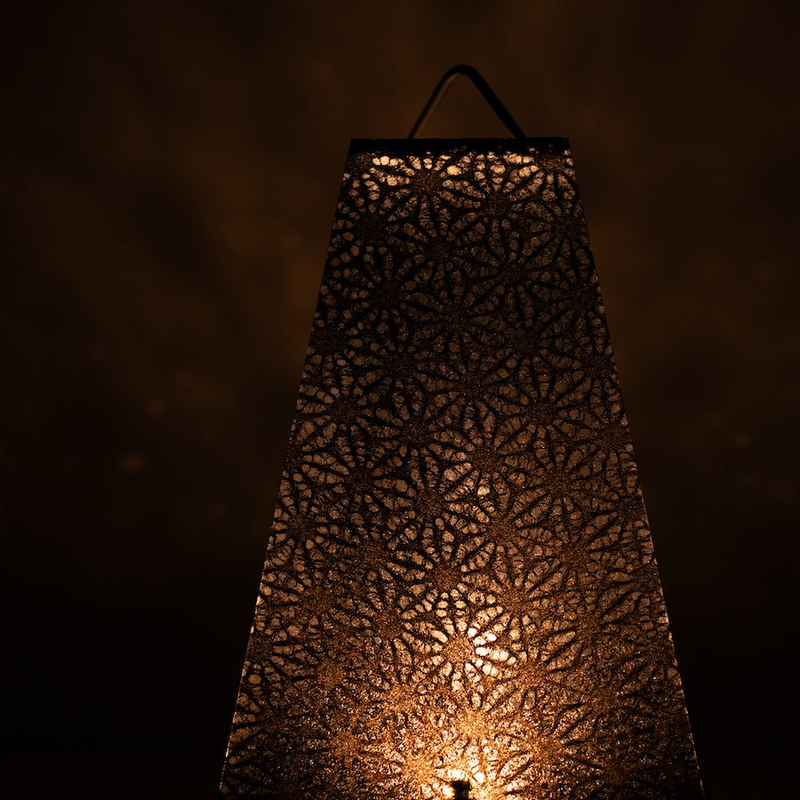 Japanese Paper Table Lamp "Mini Akari", black, Mino Washi paper - close-up of illuminated traditional Japanese lace pattern.