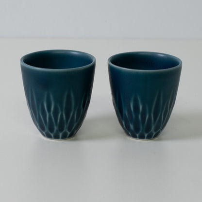 Matte lapis sake cups, blue, porcelain - Two matte blue Japanese sake cups with carved base details