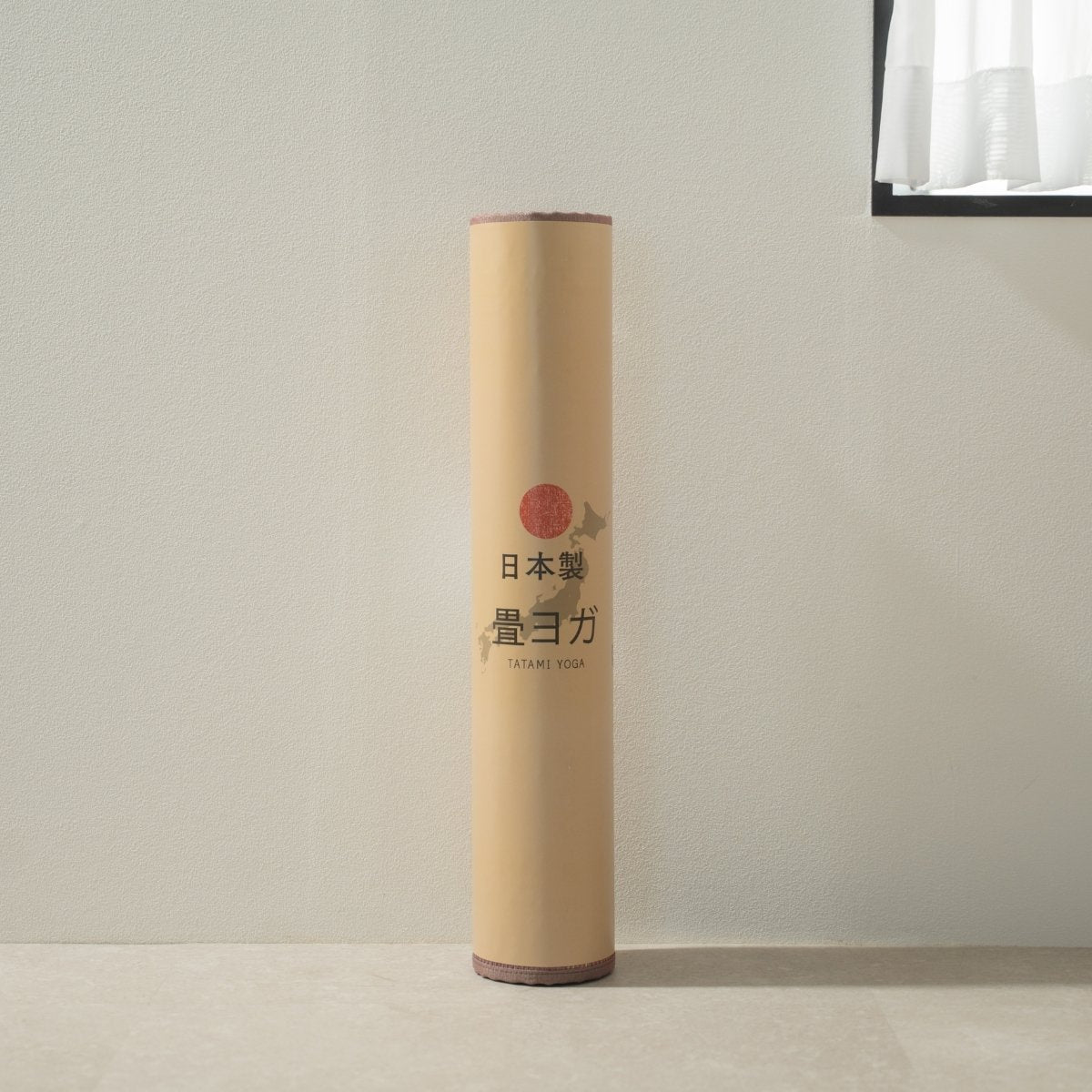 Packaged Japanese Tatami Yoga Mattress "Marble" Pink standing in a minimal room, ready for your home yoga practice.